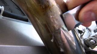 Remove burnt-on stuff from exhaust