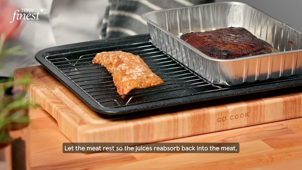 Slow cooked pork belly with smoky potato and cauliflower purée, caper and herb vinaigrette and pork crackling