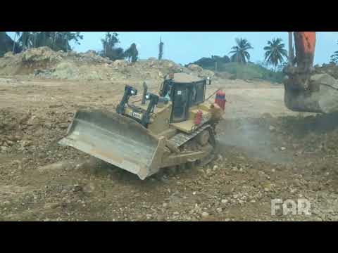 caterpillar D8GC Bulldozer in action.pushing rocks