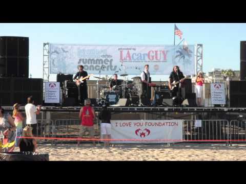 Jeremy Buck and the Bang perform on the sand in Hermosa Beach