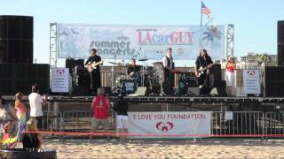 Jeremy Buck and the Bang perform on the sand in Hermosa Beach
