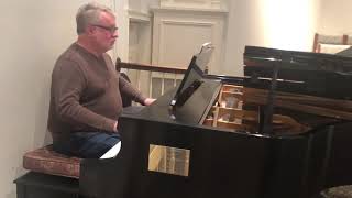 Rick Robertson plays “I Love to Tell the Story”