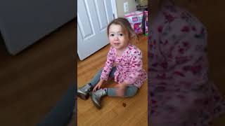Juliet putting on her shoes