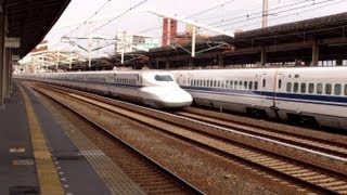 Limited Stop Shinkansen (Japanese Bullet Train) fly by, while the Local Shinkansen waits!