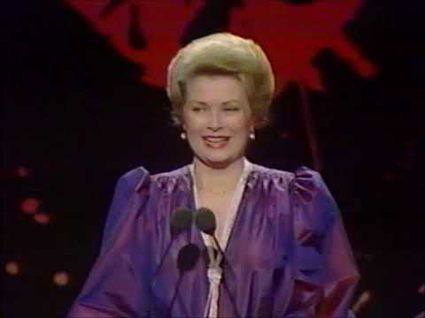 Princess Grace of Monaco salutes James Stewart in 1981.