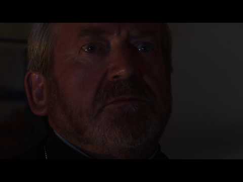 Terry Palmer as Father Danes in Fight the Eternal Evil