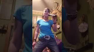 Singing to seven year ache by Trisha yearwood. Awesome song