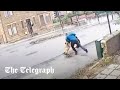 Man dragged into the road as he tries to fight off attacking dog