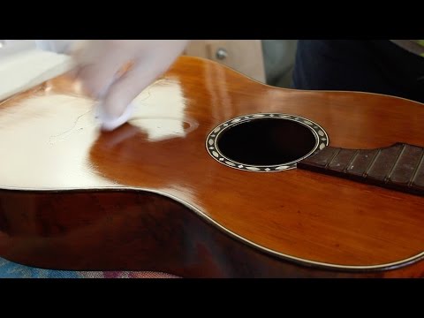 Restoring an antique parlour guitar part 32: French polishing with olive oil