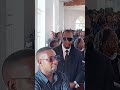 Singer Coco Finger & GNL Zamba join other mourners in a memorial Mass of Peter Miles Mother