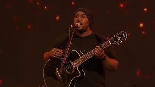 Worship leader Sam Nke leads the congregation with Falling in love with Jesus (snippet)