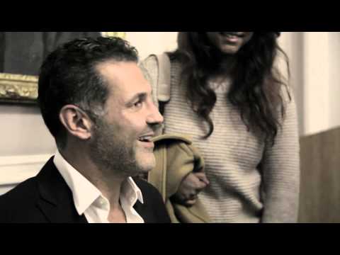 Khaled Hosseini signing books with Bloomsbury Institute