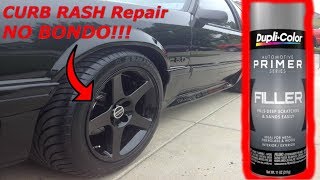 Curb Rash Repair on Black Wheel