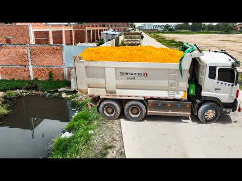 Perfect First Start New Landfill By Skill Dozer Pushing Stone Canal Flooded With DongFeng Trucks