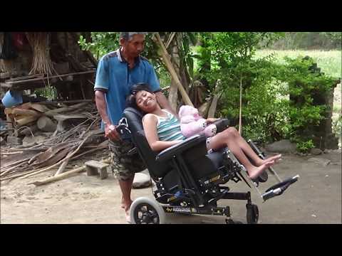 After waiting 21 years, young Komang Erni receives her first wheelchair. (Fur Erni)