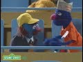 Sesame Street Mr Johnson Tries To Catch A Foul Ball At A Baseball Game