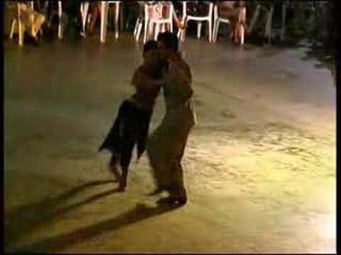  Javier Rodriguez  and  Geraldine Rojas  are  dancing  to  the  milonga  "  Milonga De Mis Amores  "