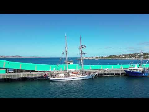 DJI mini 3 pro ,One and All sail boat tying up at Port Lincoln wharf