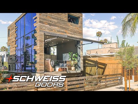 Modern Beach House with a Schweiss Doors Hydraulic Glass Wall