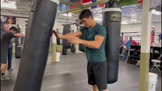 KO artist Dmitriy Bivol bare hands heavybag work in camp for Canelo | esnews boxing