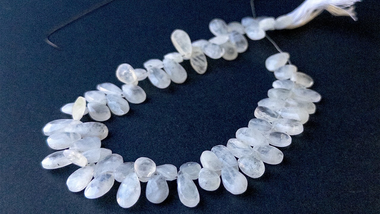 White Rainbow Moonstone | Faceted Briolette Pear | 6-7mm Bead Size | 27cm Strand Length | 65 Pieces video