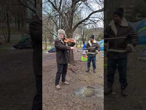 Russian violinist, Sergei Galperin, of the Houston Symphony provides soulful music to homeless.