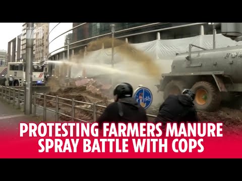 Protesting farmers spray manure at riot police on Brussels streets