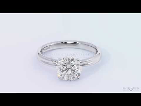 Twisted crossover four claw engagement ring