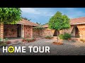 In This Eco Friendly House Village Life Inspires Modern Design House Tour