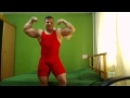 Gabriel MuscleDominus-flexing in wrestling singlet