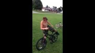 preview picture of video 'Hilarious Wheelie. Our son wanted to prove he could do a wheelie, so mom recorded it.'