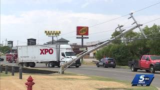 Semi hits power lines, shutting down Memorial Road and causing power outages in the area