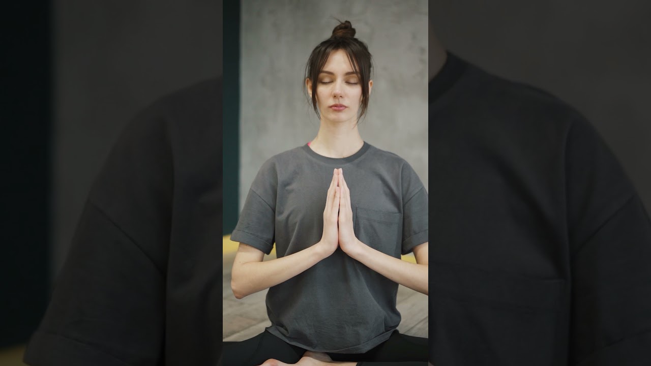 A Woman Meditating In Lotus Position