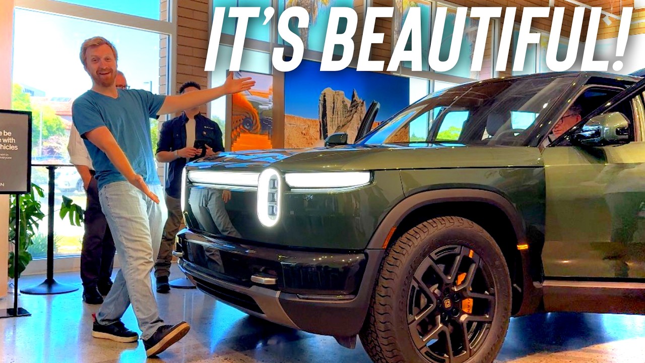 Tailosive EV exploring the interior of the Rivian R2 at a show event with R1S visible alongside