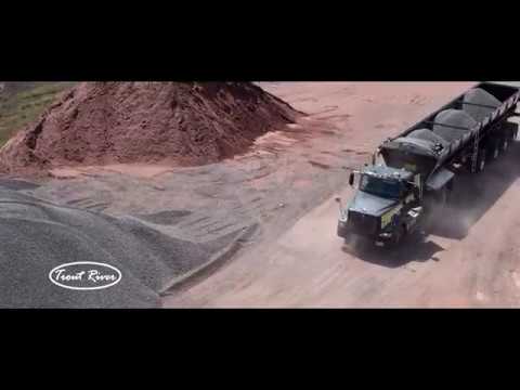 2020 Trout River Live Bottom Trailer unloading in a pit
