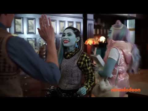 Monster High: The Movie trailer frame with Clawdeen, Frankie, and Draculaura entering the school foyer