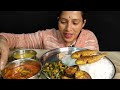 eating fish curry fried fish bengan fry onion leaves and aloo fry dal with rice