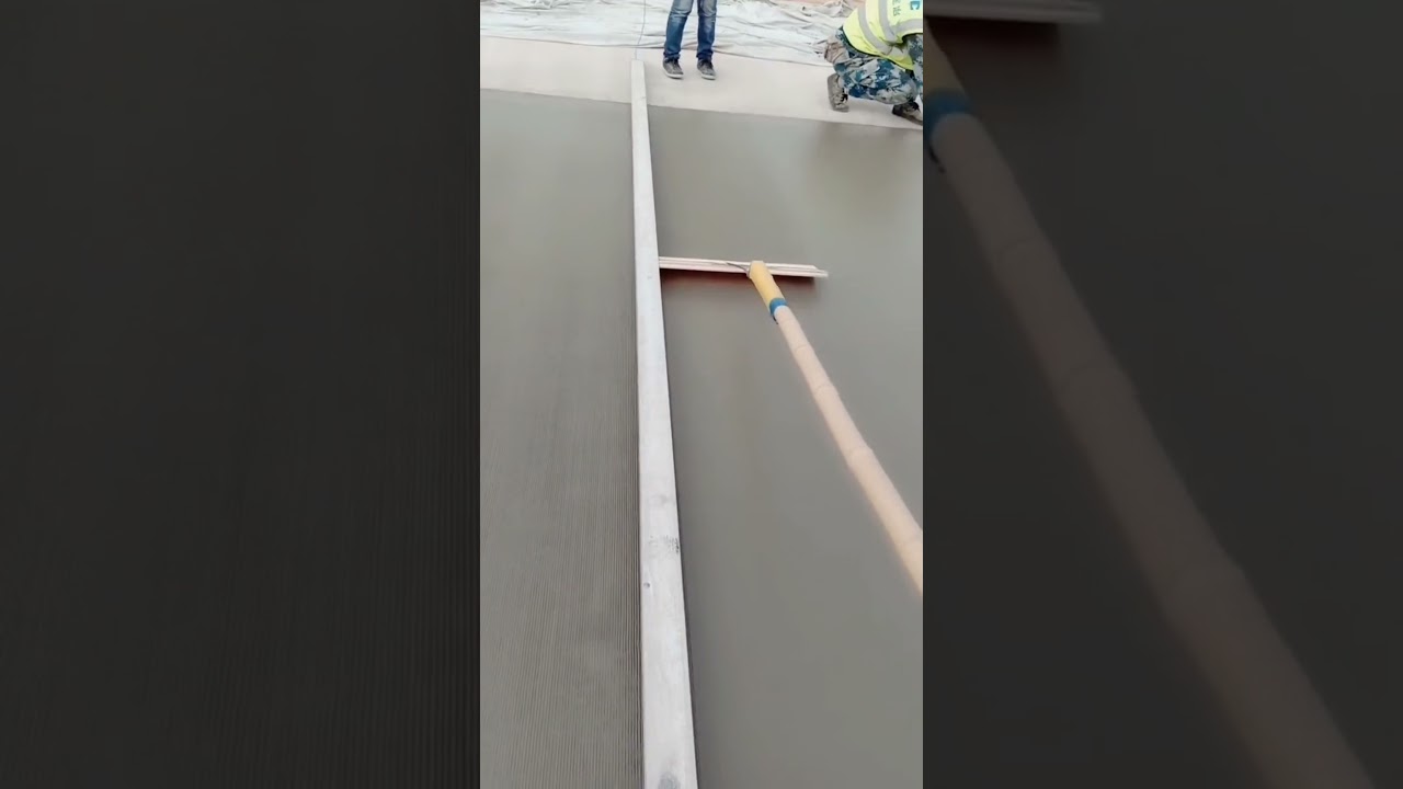 Concrete surface finishing for road construction