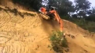 Excavator operator drops off steep embankment - to save time!