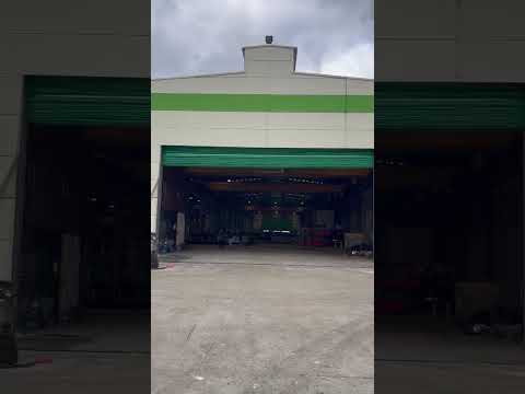 Power XL industrial hangar fold up door designed for factories, warehouses, and large industrial facilities.