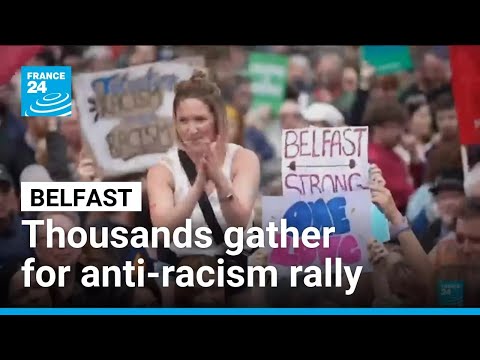 Thousands rally in Belfast to condemn anti-immigrant rioting that followed stabbing