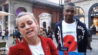 Volunteers sell Remembrance Sunday Poppies in Covent Garden