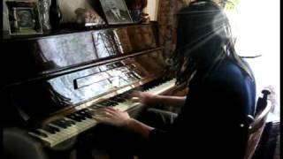 Dreadlock boy plays piano and singing