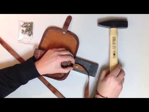Part of a video titled Come mettere una nuova tracolla alla tua borsa | Fai da te | Gusti Pelle