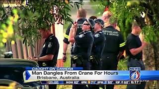 Man dangles from crane for hours
