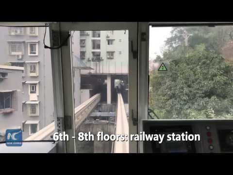 Watch: This train passes through residential building in China!