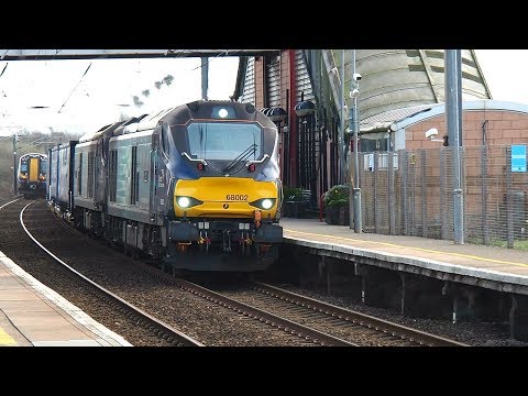 68002 (Intrepid) and 68023 (Achilles) pass through Prestwick Airport station.