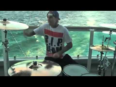 Travis Barker drumming in the middle of the Atlantic Ocean
