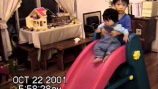 preview picture of video 'Twins helped younger sister slide the slide at home. 20011022'