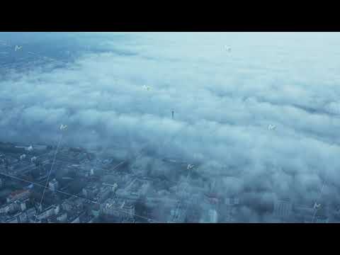 Aerial panoramic footage of morning city shrouded in fog. Visible buildings in urban neighbourhood